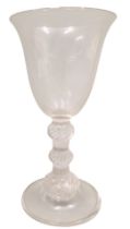 A late 18th/early 19thC wine glass, with a bell shaped bowl and triple air twist knopped stem, fold