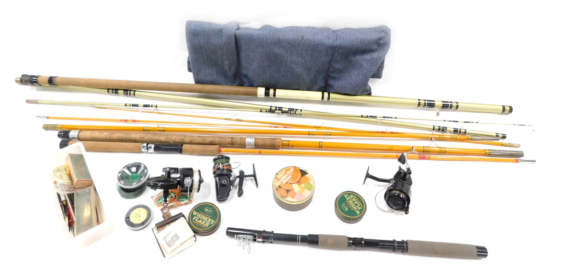 A quantity of fishing tackle, to include a Midas rod, three piece fishing rod, Mitchell reel, etc.