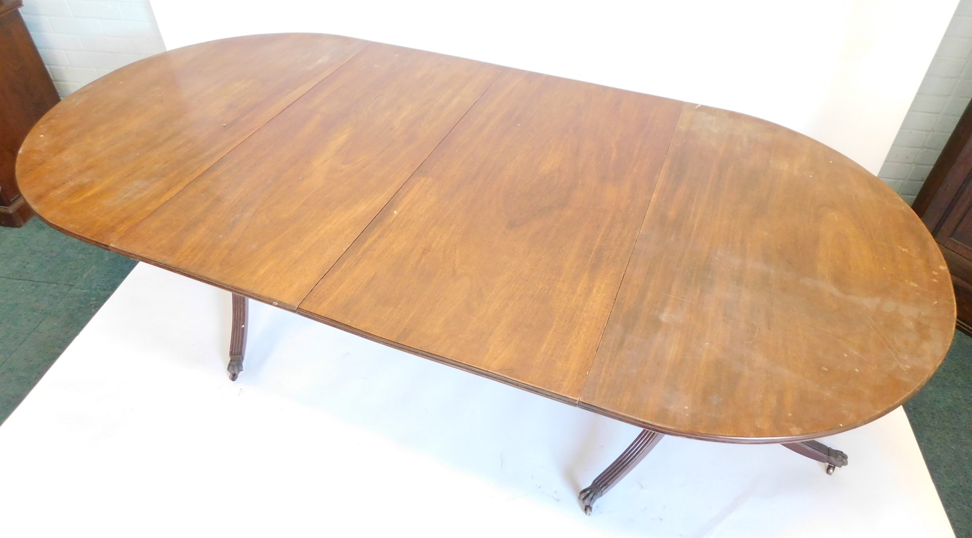 A Regency style mahogany extending dining table, the rectangular top with rounded ends and a moulded - Image 2 of 3