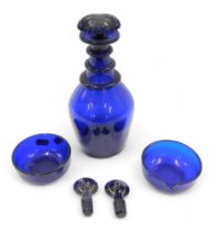 A 19thC Bristol Blue triple necked decanter, with mushroom shaped stopper, 25cm high, and two small