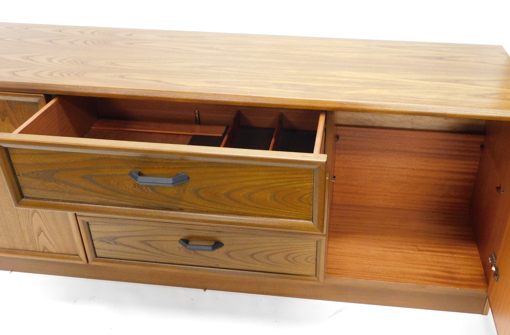 A G-Plan teak low sideboard, with an arrangement of three drawers and two doors, on a plinth, 67cm h - Image 4 of 4