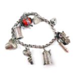 A charm bracelet, with belcher link charm, two padlocks and safety chain, with various charms stampe