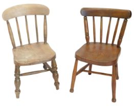 Two ash and elm child's chairs, each with a spindled turned back and a solid seat.
