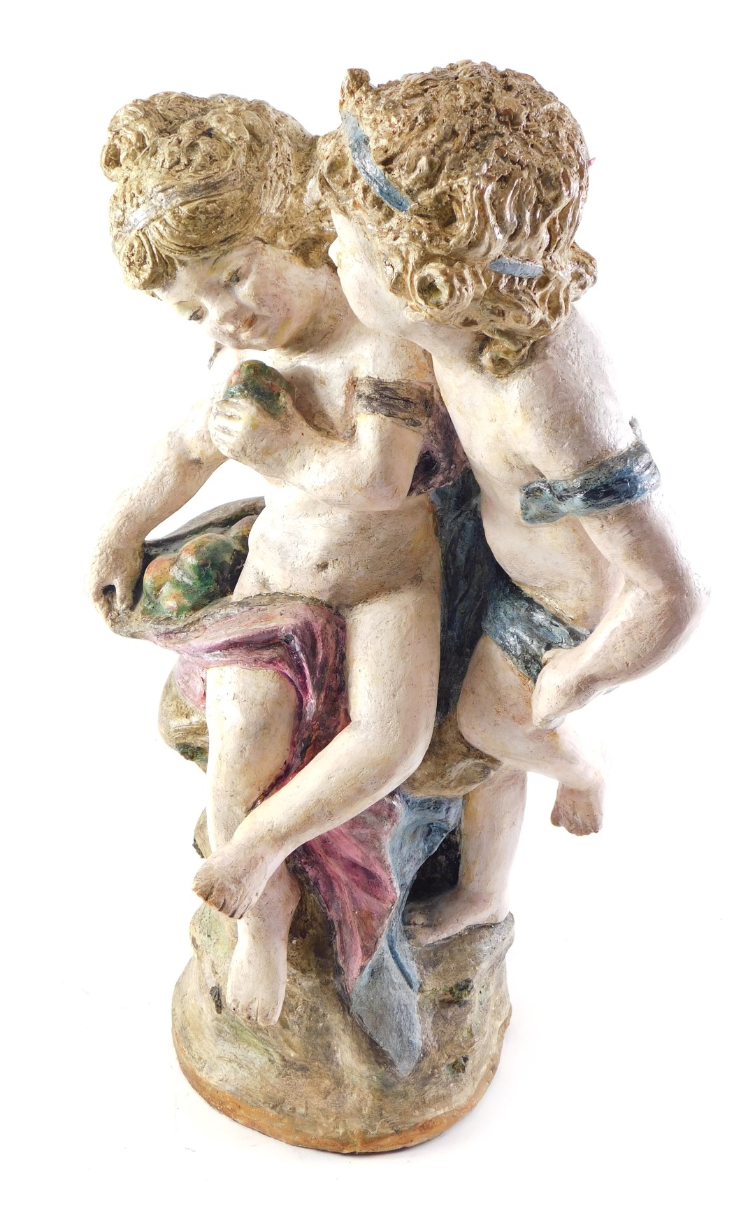 A Continental composition figure group, modelled in the form of two children seated on a rock, unmar