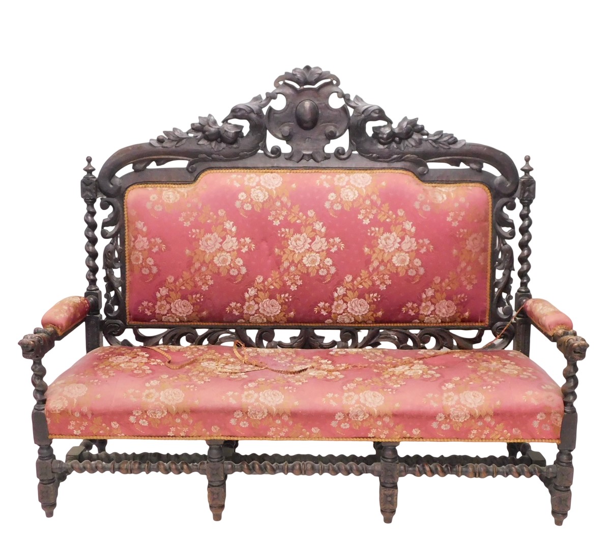 A late 19th/early 20thC ebonised oak sofa, in Carolean style, the high back decorated with scrolls,