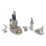 A Lladro porcelain figure group, modelled in the form of a lady with pigs, and other Lladro.