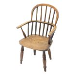 A 19thC ash and elm child's Windsor chair, with spindled turned back and solid seat, on turned legs.