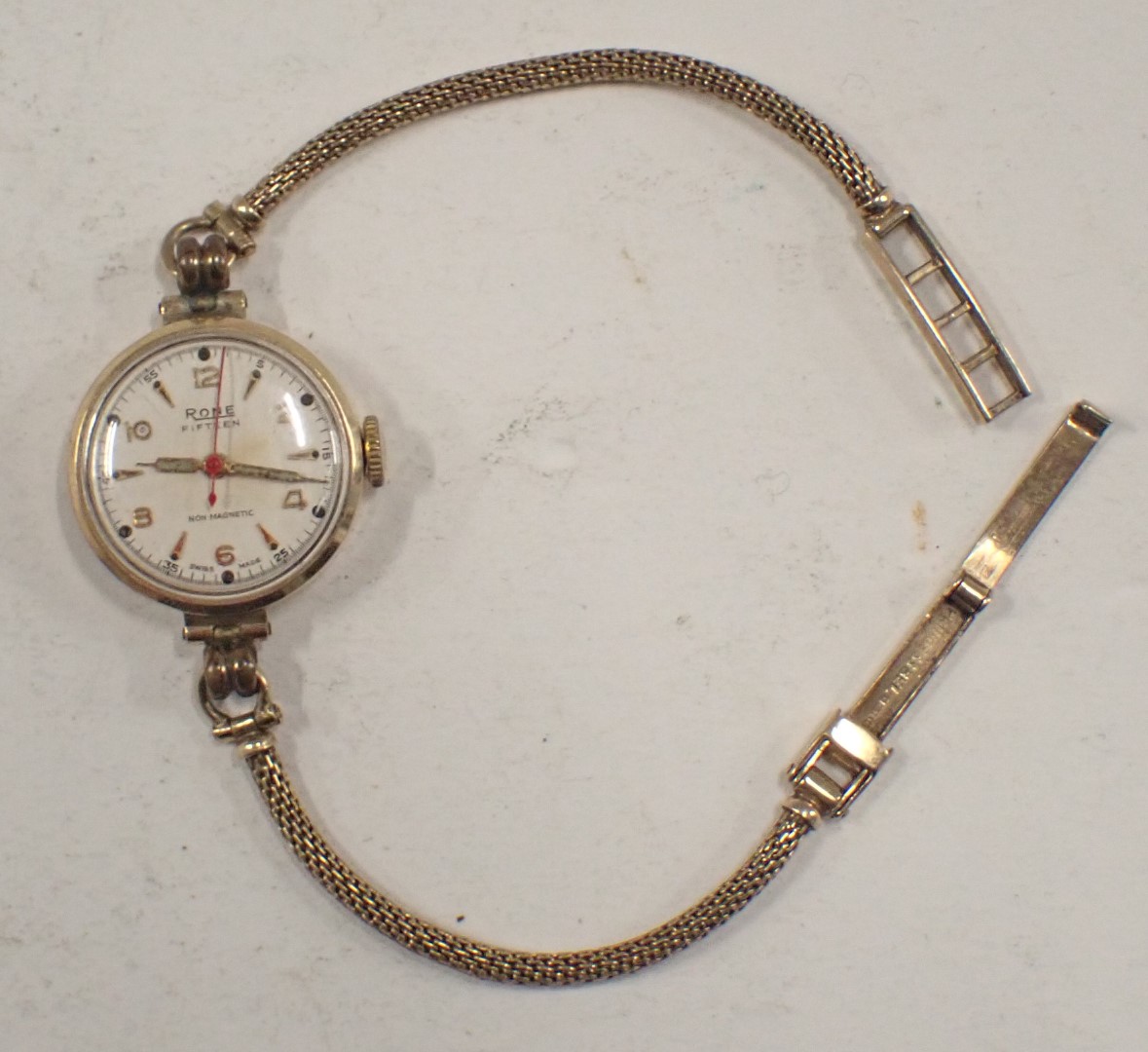 A Rone ladies wristwatch, with white finish numeric dial, in yellow metal case, unmarked, on 9ct gol - Image 2 of 3