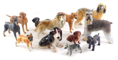 A quantity of ceramic dogs, various breeds. (1 tray)