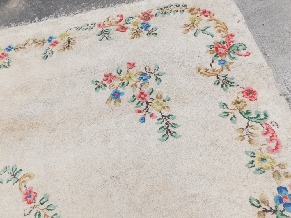 An Indian carpet, with a design of flowers on a cream ground, 540 x 361cm. - Image 3 of 4