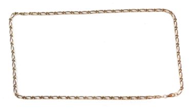 A fancy link neck chain, with elongated links and crossover, with clip clasp, yellow metal stamped 3