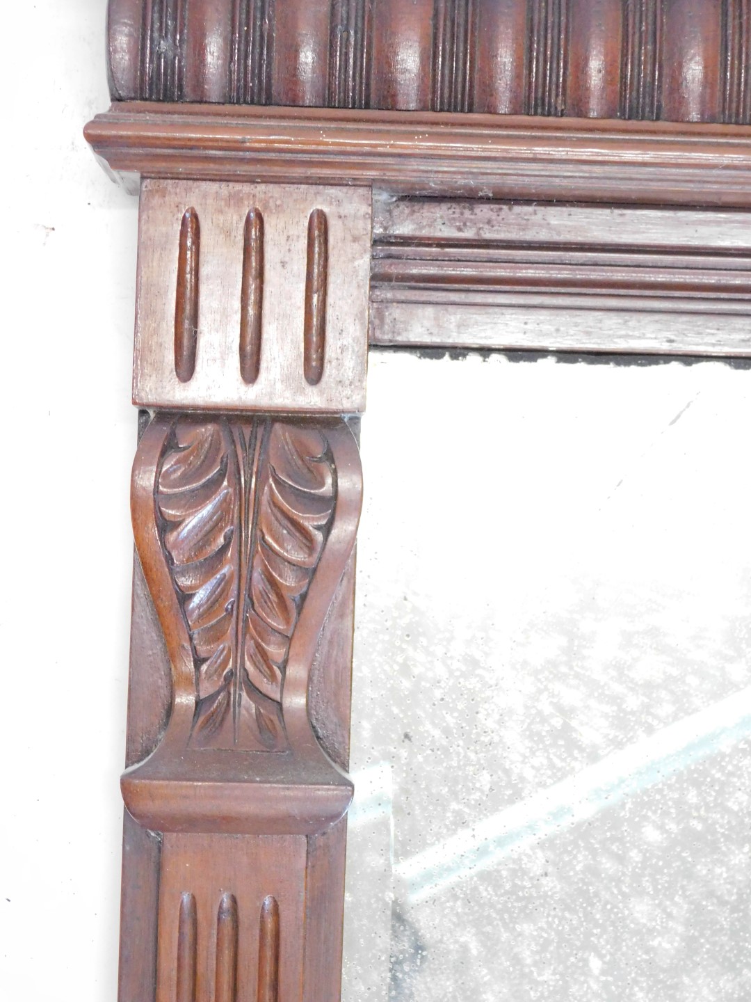 A late 19th/early 20thC walnut overmantel mirror, with a gadrooned cornice above a rectangular plate - Image 3 of 3