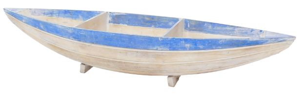 A plant or display stand, modelled in the form of a blue and cream painted rowing boat, 144cm wide.