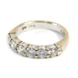 Withdrawn pre-sale. A diamond half hoop dress ring, set with six round brilliant cut diamonds,