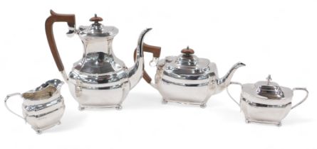 An Elizabeth II silver four piece tea and coffee set, of oval bombe design, with bun feet, comprisin
