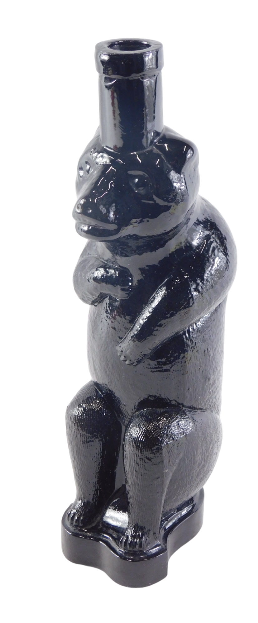 A Russian 20thC bear shaped black glass decanter, lacking stopper, 29cm high.