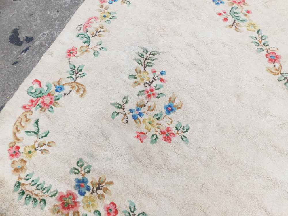 An Indian carpet, with a design of flowers on a cream ground, 540 x 361cm. - Image 2 of 4
