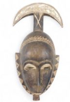 Tribal Art. Baule/Baoule tribe, Mblo portrait mask with 'Moon crescent' coiffure, collected from vil
