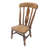 A late 19thC ash and elm low chair, with a pierced splat, solid seat on turned legs, with H stretche