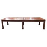A large mahogany conference or office table, in Chippendale style, the rectangular top in two parts,