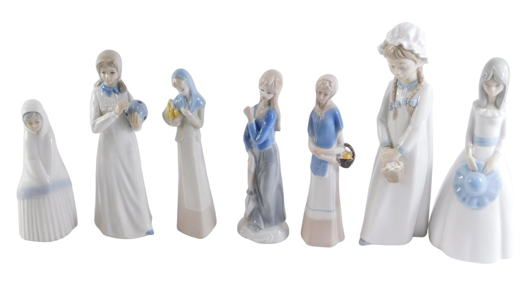 A group of Nao and other Spanish porcelain figures, the largest 26cm high. (7)