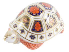 A Royal Crown Derby tortoise paperweight, with silver stopper, 12cm diameter.