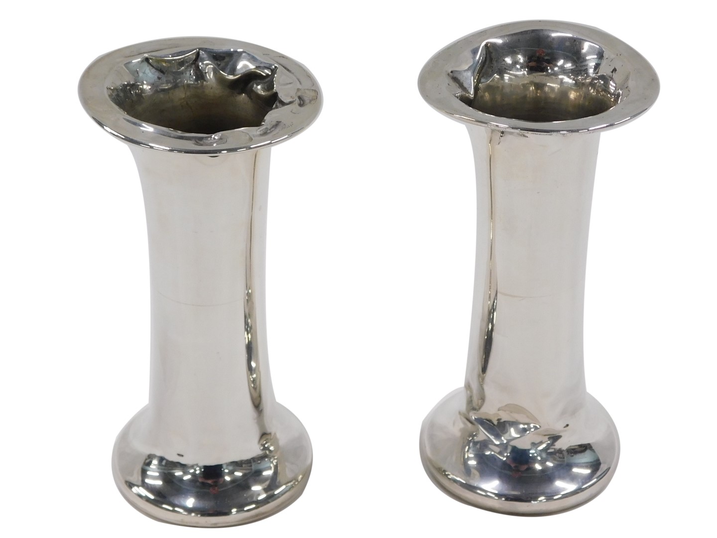 A pair of George V silver posy vases, of plain flared cylindrical design, filled bases with oak inse