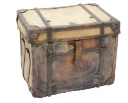 An early 20thC canvas and leather cabin trunk, with iron straps, 51cm high, 58cm wide.