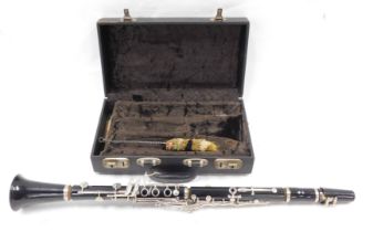 A Boosey & Hawkes Regent black clarinet, in fitted case.