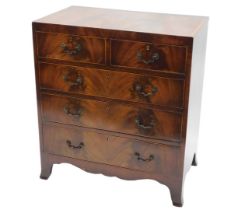 A mahogany and satinwood crossbanded chest of drawers, in George III style, with two short and three