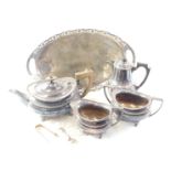 A silver plated three piece tea set, oval tray, and hot water jug.