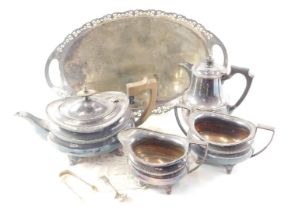 A silver plated three piece tea set, oval tray, and hot water jug.