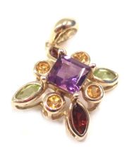 A cluster pendant, with central square cut amethyst, surrounded by four citrines and two peridot and