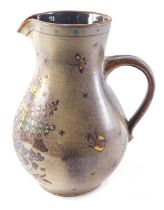 A large studio pottery jug or flagon, with polychrome decoration of flowers, leaves, etc., maker sta