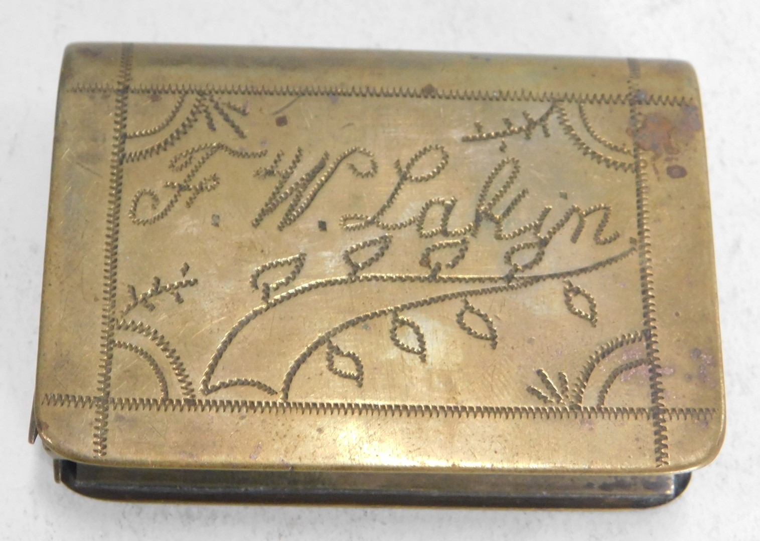 A mid 20thC brass match case, with hammered detail of gentleman playing football, bearing the initia - Image 2 of 3