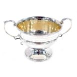 A late Victorian two-handled silver sugar basin, of urn shaped design with leaf capped query handles