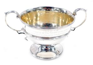 A late Victorian two-handled silver sugar basin, of urn shaped design with leaf capped query handles