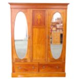 An Edwardian mahogany marquetry and chequer banded double wardrobe, with a moulded cornice above two