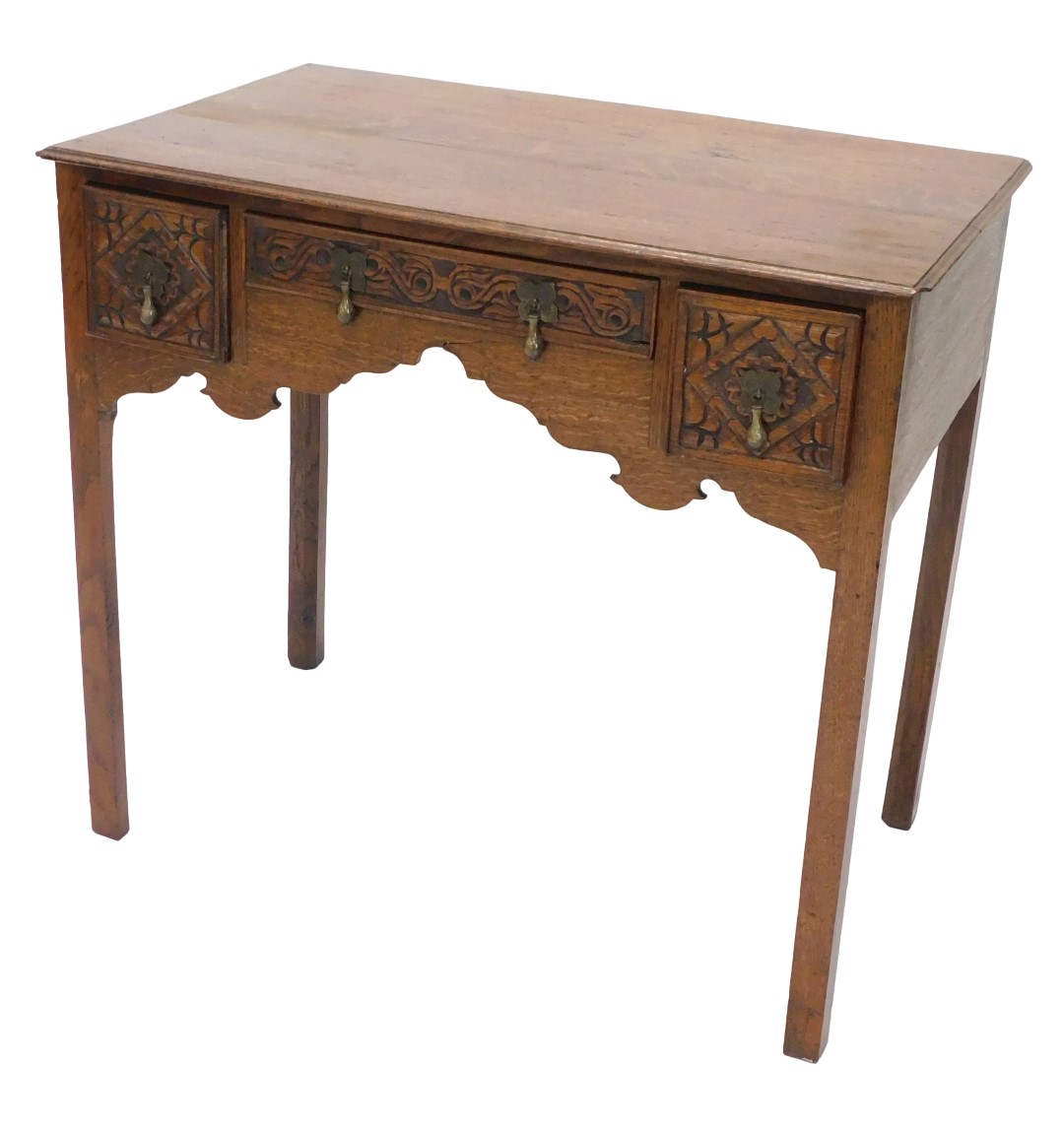 An early 19thC oak lowboy, the rectangular top with a moulded edge above three later carved drawers,