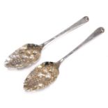 A pair of George III silver berry spoons, the embossed and engraved decoration later, London 1799, 3