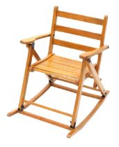 A beech slatted folding child's rocking chair.