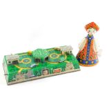 A Russian tin plate clock work bus toy, boxed, and a Russian tin plate mechanical doll. (2)