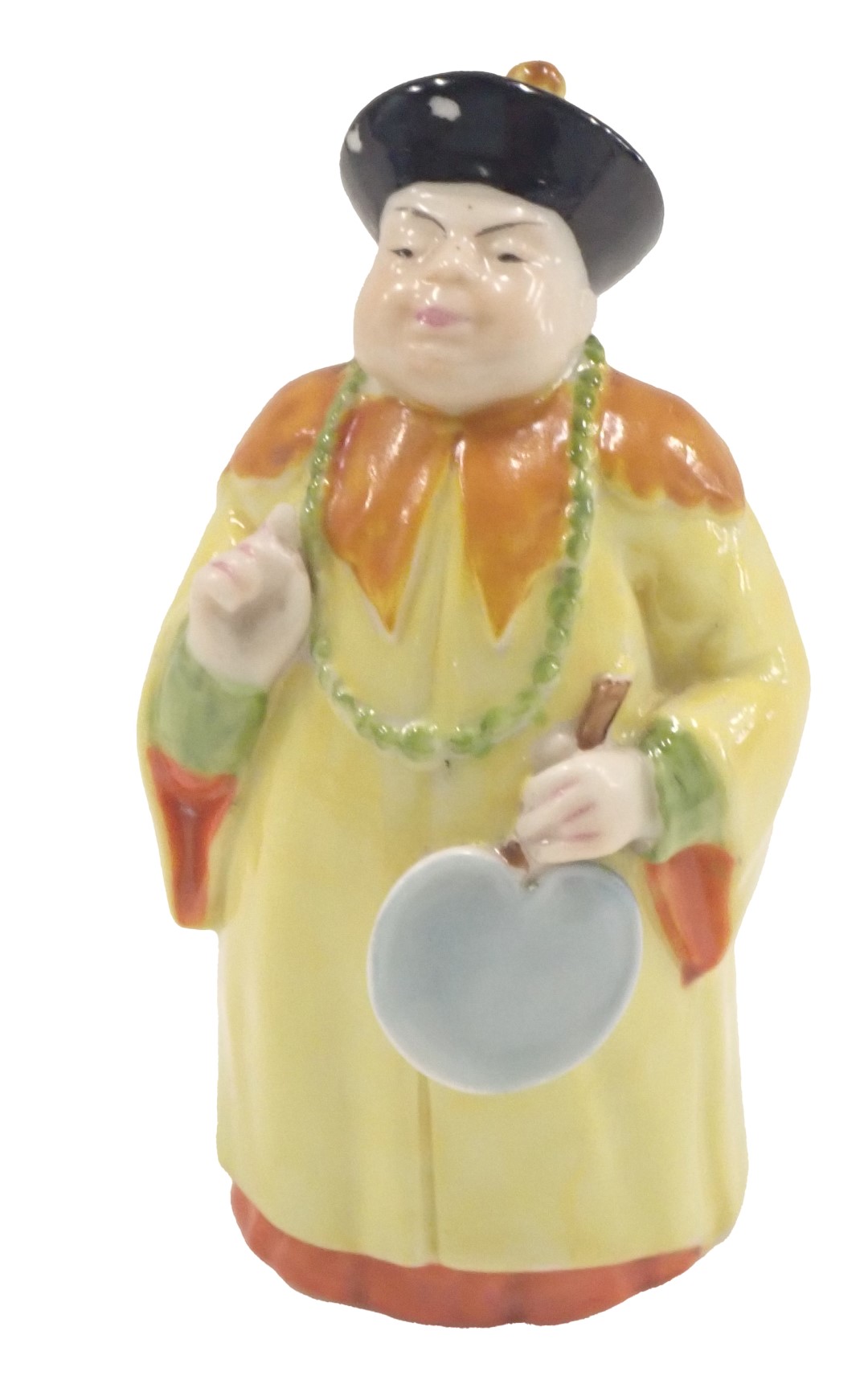 A Royal Worcester porcelain candle snuffer, formed as a figure in flowing yellow robe, 10cm high.