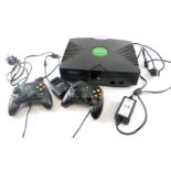 An X-Box games console, with controllers.