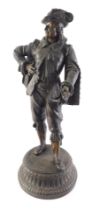 A late 19thC French bronzed spelter figure of a soldier, on a circular base, 53cm high.