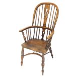 An ash and elm Windsor chair, with a pierced splat, solid seat, on turned legs with crinoline stretc