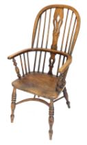 An ash and elm Windsor chair, with a pierced splat, solid seat, on turned legs with crinoline stretc
