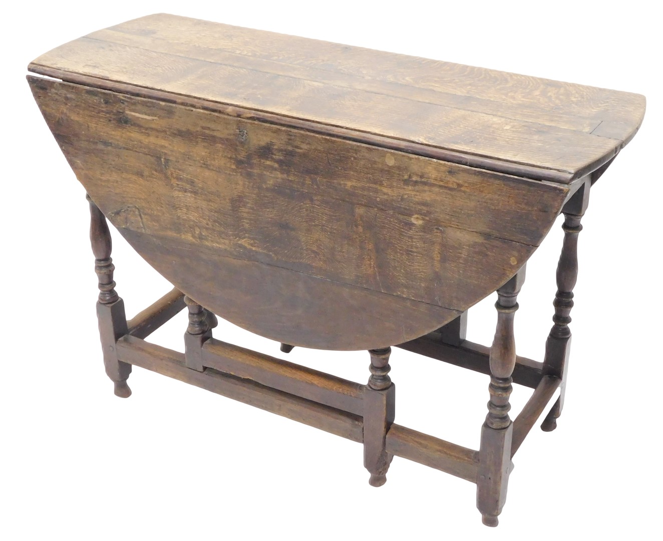 An 18thC oak oval gate leg table, on turned supports, 109cm wide. (AF)
