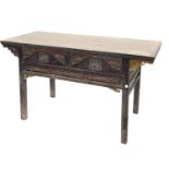 A Chinese red stained altar table, with a plank top above two carved frieze drawers flanked by pierc