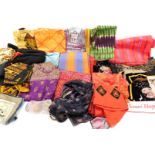 A quantity of Eastern fabrics, to include pieces with metallic threads, silks, costume bangles, etc.
